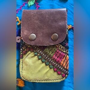 Green and cream free people card case. Measures approximately 4 x 5”. New!